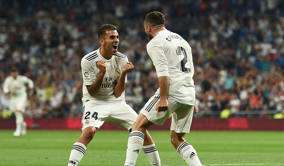 MADRID, SPAIN - AUGUST 19: Dani Carvajal of Real Madrid celebrates with teammate Daniel Ceballos of Real Madrid after scoring his teams opening goal during the La Liga match between Real Madrid CF and Getafe CF at Estadio Santiago Bernabeu on August 19, 2018 in Madrid, Spain. (Photo by Denis Doyle/Getty Images)