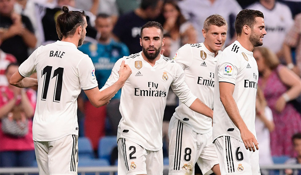Real Madrid's Spanish defender Dani Carvajal (2ndL) celebrates with teammates after scoring a goal during the Spanish League football match between Real Madrid and Getafe at the Santiago Bernabeu stadium in Madrid on August 19, 2018. (Photo by JAVIER SORIANO / AFP) (Photo credit should read JAVIER SORIANO/AFP/Getty Images)