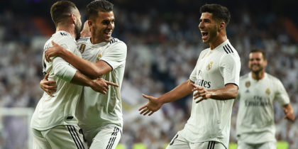 MADRID, SPAIN - AUGUST 19: Dani Carvajal (left) of Real Madrid celebrates with team-mates Daniel Ceballos and Marco Asensio (right) after scoring his team's opening goal during the La Liga match between Real Madrid CF and Getafe CF at Estadio Santiago Bernabeu on August 19, 2018 in Madrid, Spain. (Photo by Denis Doyle/Getty Images)