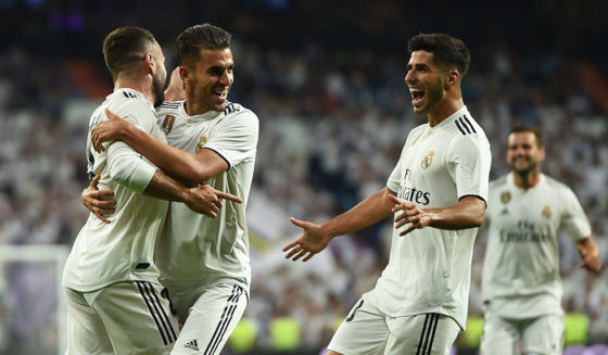 MADRID, SPAIN - AUGUST 19: Dani Carvajal (left) of Real Madrid celebrates with team-mates Daniel Ceballos and Marco Asensio (right) after scoring his team's opening goal during the La Liga match between Real Madrid CF and Getafe CF at Estadio Santiago Bernabeu on August 19, 2018 in Madrid, Spain. (Photo by Denis Doyle/Getty Images)
