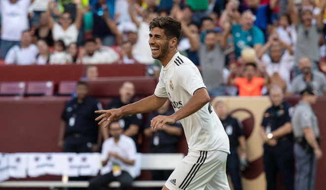 Real Madrid's Marco Asensio celebrates after scoring a goal during the International Champions Cup (ICC) friendly football match between Real Madrid and Juventus at Fedex Field in Landover, Maryland, on August 4, 2018. (Photo by NICHOLAS KAMM / AFP) (Photo credit should read NICHOLAS KAMM/AFP/Getty Images)