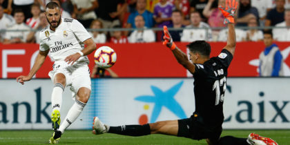 Real Madrid's French forward Karim Benzema (L) shoots against Girona's Moroccan goalkeeper Yassine Bounou during the Spanish league football match between Girona FC and Real Madrid CF at the Montilivi stadium in Girona on August 26, 2018. (Photo by Pau Barrena / AFP) (Photo credit should read PAU BARRENA/AFP/Getty Images)