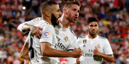 Real Madrid's French forward Karim Benzema (L) celebrates scoring his team's second goal with Real Madrid's Spanish defender Sergio Ramos during the Spanish league football match between Girona FC and Real Madrid CF at the Montilivi stadium in Girona on August 26, 2018. (Photo by Pau BARRENA CAPILLA / AFP) (Photo credit should read PAU BARRENA CAPILLA/AFP/Getty Images)