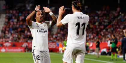 Real Madrid's Welsh forward Gareth Bale celebrates scoring his team's third goal with Real Madrid's Brazilian defender Marcelo during the Spanish league football match between Girona FC and Real Madrid CF at the Montilivi stadium in Girona on August 26, 2018. (Photo by Pau BARRENA CAPILLA / AFP) (Photo credit should read PAU BARRENA CAPILLA/AFP/Getty Images)