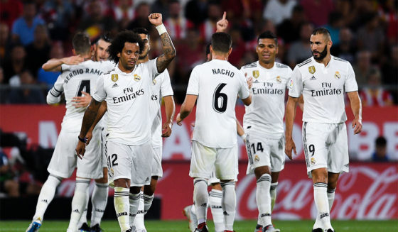 GIRONA, SPAIN - AUGUST 26: Real Madrid players celebrate after Gareth Bale of Real Madrid CF scored his team's third goal during the La Liga match between Girona FC and Real Madrid CF at Montilivi Stadium on August 26, 2018 in Girona, Spain. (Photo by David Ramos/Getty Images)