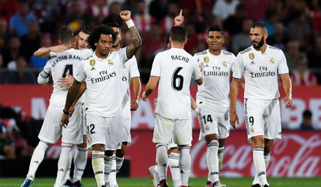 GIRONA, SPAIN - AUGUST 26: Real Madrid players celebrate after Gareth Bale of Real Madrid CF scored his team's third goal during the La Liga match between Girona FC and Real Madrid CF at Montilivi Stadium on August 26, 2018 in Girona, Spain. (Photo by David Ramos/Getty Images)
