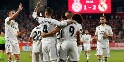 Real Madrid's French forward Karim Benzema (C) celebrates his goal with teammates during the Spanish league football match between Girona FC and Real Madrid CF at the Montilivi stadium in Girona on August 26, 2018. (Photo by Pau BARRENA CAPILLA / AFP) (Photo credit should read PAU BARRENA CAPILLA/AFP/Getty Images)