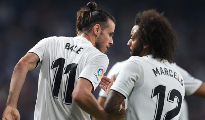 MADRID, SPAIN - AUGUST 19: Gareth Bale of Real Madrid celebrates with Marcelo after scoring his team's second goal during the La Liga match between Real Madrid CF and Getafe CF at Estadio Santiago Bernabeu on August 19, 2018 in Madrid, Spain. (Photo by Denis Doyle/Getty Images)