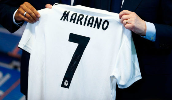 Real Madrid's Spanish-Dominican forward Mariano poses with his new number 7 jersey next to Real Madrid president Florentino Perez during his official presentation at the Santiago Bernabeu Stadium in Madrid on August 31, 2018. (Photo by BENJAMIN CREMEL / AFP) (Photo credit should read BENJAMIN CREMEL/AFP/Getty Images)