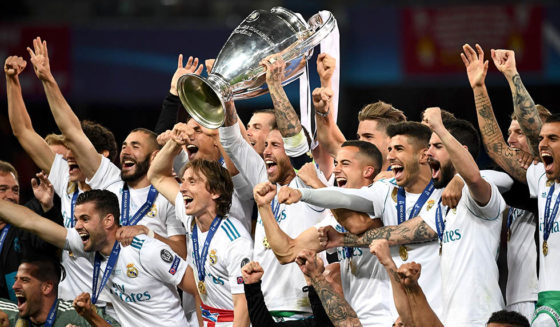 Real Madrid's players celebrate with the trophy after winning the UEFA Champions League final football match between Liverpool and Real Madrid at the Olympic Stadium in Kiev, Ukraine, on May 26, 2018. (Photo by FRANCK FIFE / AFP) (Photo credit should read FRANCK FIFE/AFP/Getty Images)