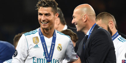 TOPSHOT - Real Madrid's French coach Zinedine Zidane (R) celebrates with Real Madrid's Portuguese forward Cristiano Ronaldo after winning the UEFA Champions League final football match between Liverpool and Real Madrid at the Olympic Stadium in Kiev, Ukraine, on May 26, 2018. (Photo by FRANCK FIFE / AFP) (Photo credit should read FRANCK FIFE/AFP/Getty Images)
