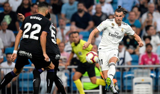 Real Madrid's Welsh forward Gareth Bale (R) challenges Leganes' Greek defender Dimitrios Siovas (L) during the Spanish league football match between Real Madrid CF and Club Deportivo Leganes SAD at the Santiago Bernabeu stadium in Madrid on September 1, 2018. (Photo by GABRIEL BOUYS / AFP) (Photo credit should read GABRIEL BOUYS/AFP/Getty Images)