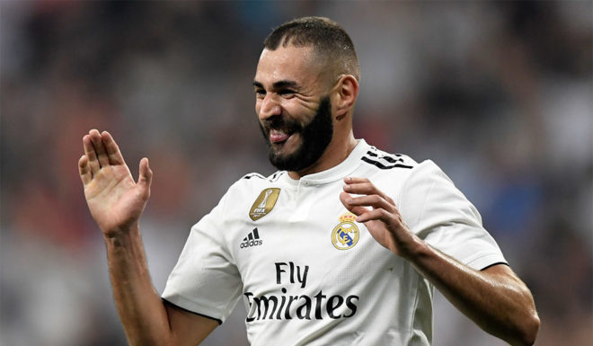 Real Madrid's French forward Karim Benzema celebrates after scoring his team's third goal during the Spanish league football match between Real Madrid CF and Club Deportivo Leganes SAD at the Santiago Bernabeu stadium in Madrid on September 1, 2018. (Photo by GABRIEL BOUYS / AFP) (Photo credit should read GABRIEL BOUYS/AFP/Getty Images)