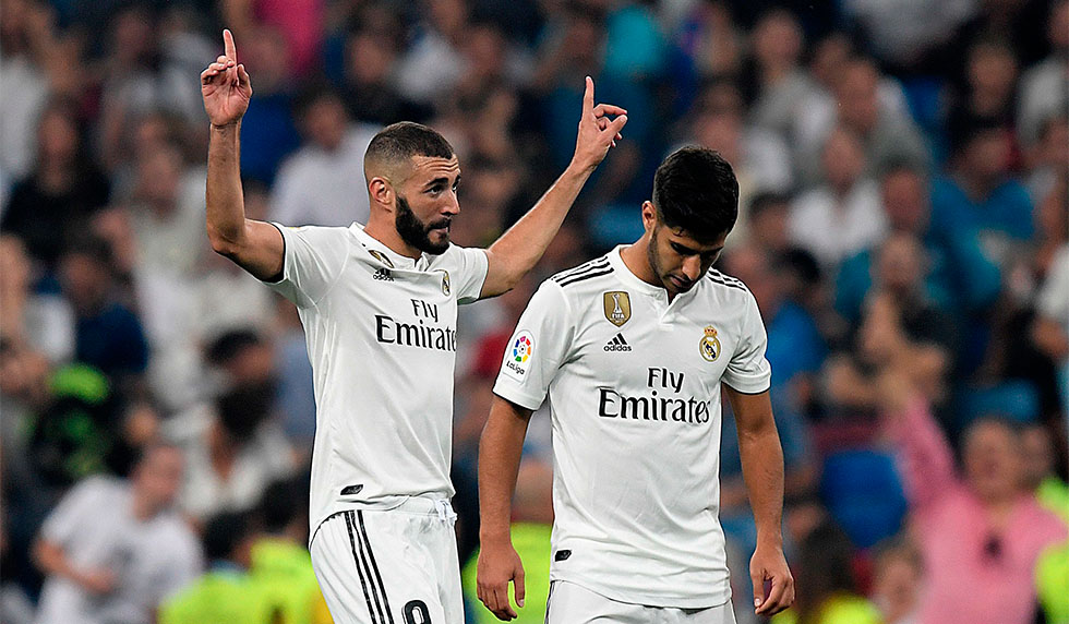 Real Madrid's French forward Karim Benzema (L) celebrates with Real Madrid's Spanish midfielder Marco Asensio after scoring a goal during the Spanish league football match between Real Madrid CF and Club Deportivo Leganes SAD at the Santiago Bernabeu stadium in Madrid on September 1, 2018. (Photo by GABRIEL BOUYS / AFP) (Photo credit should read GABRIEL BOUYS/AFP/Getty Images)