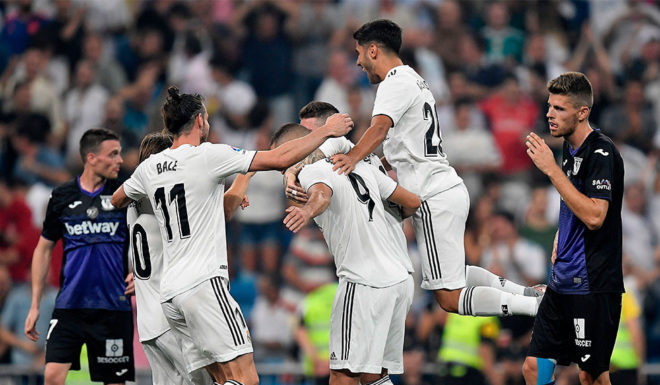 Real Madrid's players celebrate their second goal during the Spanish league football match between Real Madrid CF and Club Deportivo Leganes SAD at the Santiago Bernabeu stadium in Madrid on September 1, 2018. (Photo by GABRIEL BOUYS / AFP) (Photo credit should read GABRIEL BOUYS/AFP/Getty Images)