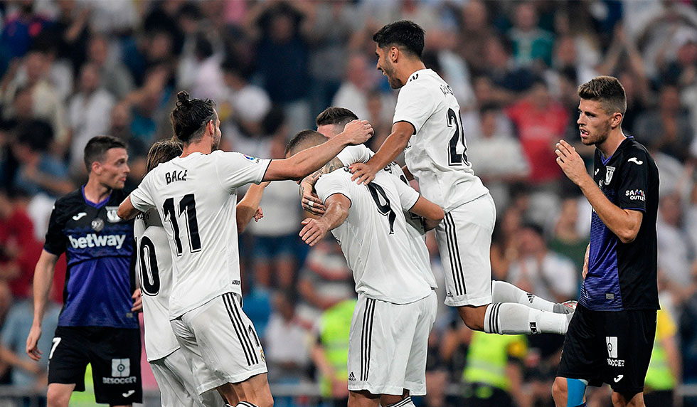 Real Madrid's players celebrate their second goal during the Spanish league football match between Real Madrid CF and Club Deportivo Leganes SAD at the Santiago Bernabeu stadium in Madrid on September 1, 2018. (Photo by GABRIEL BOUYS / AFP) (Photo credit should read GABRIEL BOUYS/AFP/Getty Images)