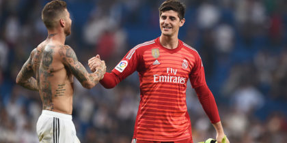 MADRID, SPAIN - SEPTEMBER 01: Thibaut Courtois of Real Madrid is congratulated by teammate Sergio Ramos after playing his first La Liga match during the La Liga match between Real Madrid CF and CD Leganes at Estadio Santiago Bernabeu on September 1, 2018 in Madrid, Spain. (Photo by Denis Doyle/Getty Images)