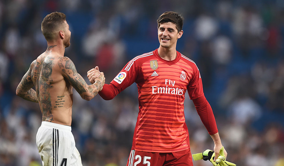 MADRID, SPAIN - SEPTEMBER 01: Thibaut Courtois of Real Madrid is congratulated by teammate Sergio Ramos after playing his first La Liga match during the La Liga match between Real Madrid CF and CD Leganes at Estadio Santiago Bernabeu on September 1, 2018 in Madrid, Spain. (Photo by Denis Doyle/Getty Images)