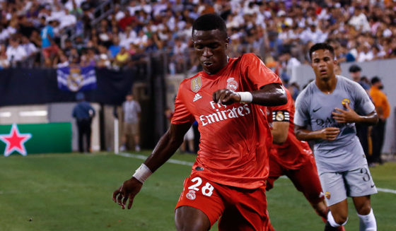 EAST RUTHERFORD, NJ - AUGUST 7: Rick Karsdorp #2 of Roma defends Vinicius Junior #28 of Real Madrid during their match at MetLife Stadium on August 7, 2018 in East Rutherford, New Jersey. (Photo by Jeff Zelevansky/Getty Images)