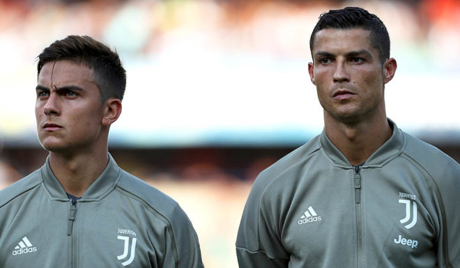 VERONA, ITALY - AUGUST 18: Paulo Dybala and Cristiano Ronaldo of Juventus FC looks on before the Serie A match between Chievo Verona and Juventus at Stadio Marc'Antonio Bentegodi on August 18, 2018 in Verona, Italy. (Photo by Marco Luzzani/Getty Images)