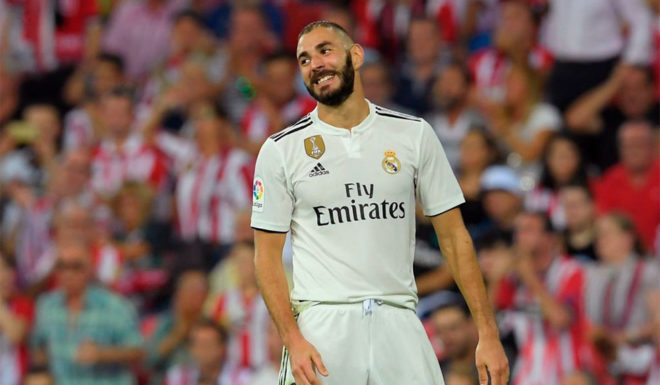 Real Madrid's French forward Karim Benzema reacts during the Spanish league football match between Athletic Club Bilbao and Real Madrid CF at the San Mames stadium in Bilbao on September 15, 2018. (Photo by LLUIS GENE / AFP) (Photo credit should read LLUIS GENE/AFP/Getty Images)
