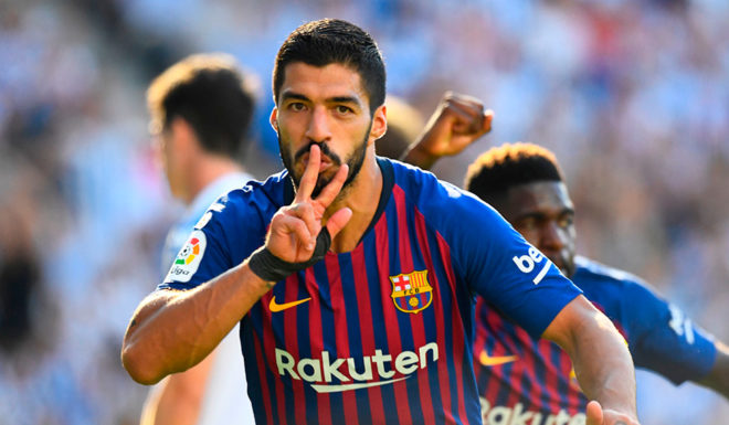 Barcelona's Uruguayan forward Luis Suarez celebrates after scoring a goal during the Spanish league football match between Real Sociedad and FC Barcelona at the Anoeta stadium in San Sebastian on September 15, 2018. (Photo by GABRIEL BOUYS / AFP) (Photo credit should read GABRIEL BOUYS/AFP/Getty Images)