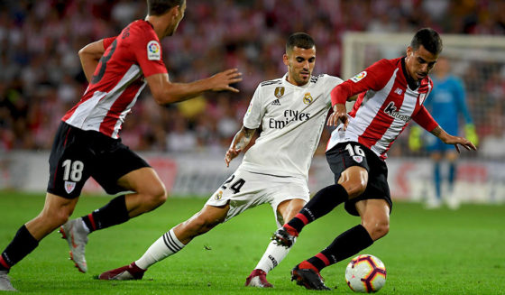 Real Madrid's Spanish midfielder Daniel Ceballos (C) vies with Athletic Bilbao's Spanish midfielder Oscar De Marcos (L) and Athletic Bilbao's Spanish midfielder Dani Garcia (R) during the Spanish league football match between Athletic Club Bilbao and Real Madrid CF at the San Mames stadium in Bilbao on September 15, 2018. (Photo by LLUIS GENE / AFP) (Photo credit should read LLUIS GENE/AFP/Getty Images)