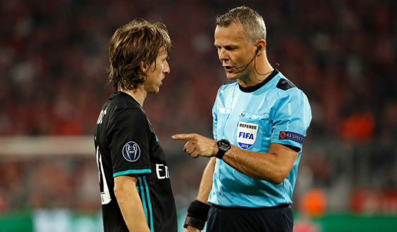 Dutch referee Bjorn Kuipers talks to Real Madrid's Croatian midfielder Luka Modric (L) during the UEFA Champions League semi-final first-leg football match FC Bayern Munich v Real Madrid CF in Munich, southern Germany on April 25, 2018. (Photo by Odd ANDERSEN / AFP) (Photo credit should read ODD ANDERSEN/AFP/Getty Images)