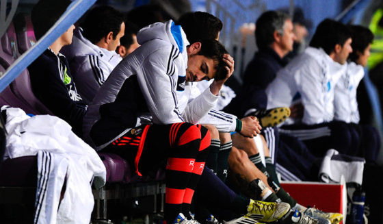 MALAGA, SPAIN - DECEMBER 22: Iker Casillas of Real Madrid CF reacts dejected on the bench after Roque Santa Cruz of Malaga CF scored his team's third goal during the La Liga match between Malaga CF and Real Madrid CF at La Rosaleda Stadium on December 22, 2012 in Malaga, Spain. (Photo by David Ramos/Getty Images)