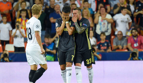 TOPSHOT - Juventus' Portuguese forward Cristiano Ronaldo (C) reacts after receiving a red card during the UEFA Champions League group H football match between Valencia CF and Juventus FC at the Mestalla stadium in Valencia on September 19, 2018. (Photo by JOSE JORDAN / AFP) (Photo credit should read JOSE JORDAN/AFP/Getty Images)