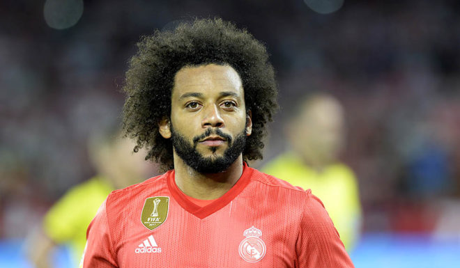 Real Madrid's Brazilian defender Marcelo (C) looks on before the Spanish league football match Sevilla FC against Real Madrid CF at the Ramon Sanchez Pizjuan stadium in Seville on September 26, 2018. (Photo by CRISTINA QUICLER / AFP) (Photo credit should read CRISTINA QUICLER/AFP/Getty Images)