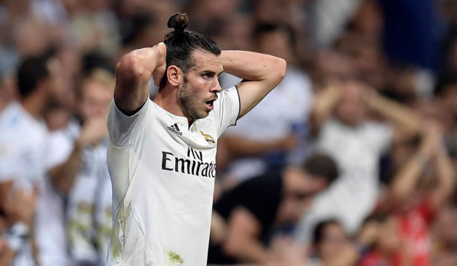 Real Madrid's Welsh forward Gareth Bale reacts during the Spanish league football match between Real Madrid CF and Club Atletico de Madrid at the Santiago Bernabeu stadium in Madrid on September 29, 2018. (Photo by OSCAR DEL POZO / AFP) (Photo credit should read OSCAR DEL POZO/AFP/Getty Images)