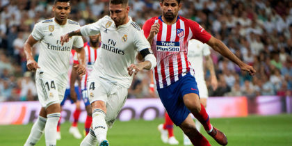 Real Madrid's Spanish defender Sergio Ramos (L) vies with Atletico Madrid's Spanish forward Diego Costa during the Spanish league football match between Real Madrid CF and Club Atletico de Madrid at the Santiago Bernabeu stadium in Madrid on September 29, 2018. (Photo by CURTO DE LA TORRE / AFP) (Photo credit should read CURTO DE LA TORRE/AFP/Getty Images)