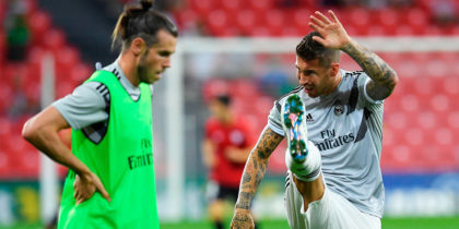 Real Madrid's Welsh forward Gareth Bale (L) and Real Madrid's Spanish defender Sergio Ramos warm up before the Spanish league football match between Athletic Club Bilbao and Real Madrid CF at the San Mames stadium in Bilbao on September 15, 2018. (Photo by LLUIS GENE / AFP) (Photo credit should read LLUIS GENE/AFP/Getty Images)