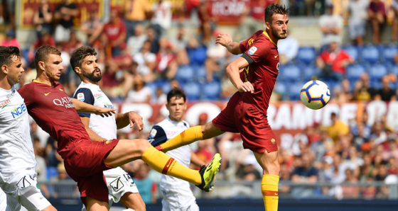 TOPSHOT - Roma's Italian midfielder Bryan Cristante (R) and Roma's Bosnian forward Edin Dzeko (2ndL) go for the ball during the Italian Serie A football match AS Rome vs Chievo Verona on September 16, 2018 at the Olympic stadium in Rome. (Photo by Alberto PIZZOLI / AFP) (Photo credit should read ALBERTO PIZZOLI/AFP/Getty Images)