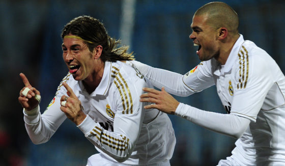 Real Madrid's defender Sergio Ramos (L) and Real Madrid's Portuguese defender Pepe (R) celebrate after scoring their first goal during their Spanish league football match Getafe against Real Madrid at Alfonso Perez stadium on February 4, 2011 in Getafe, near Madrid. AFP PHOTO/ JAVIER SORIANO (Photo credit should read JAVIER SORIANO/AFP/Getty Images)