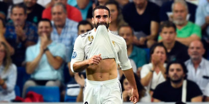 Real Madrid's Spanish defender Dani Carvajal (C) reacts to missing a goal during the UEFA Champions League group G football match between Real Madrid CF and AS Roma at the Santiago Bernabeu stadium in Madrid on September 19, 2018. (Photo by GABRIEL BOUYS / AFP) (Photo credit should read GABRIEL BOUYS/AFP/Getty Images)