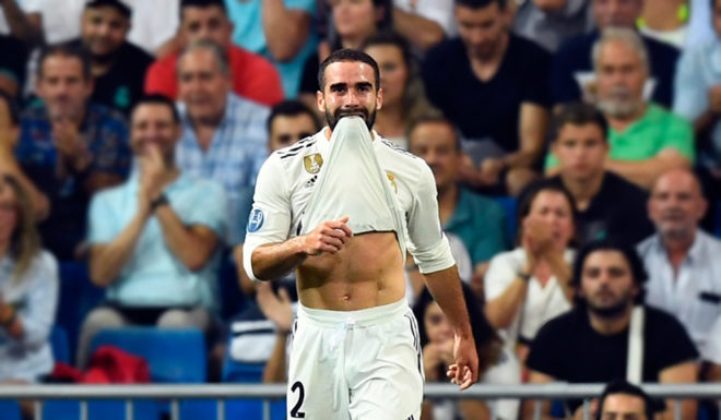 Real Madrid's Spanish defender Dani Carvajal (C) reacts to missing a goal during the UEFA Champions League group G football match between Real Madrid CF and AS Roma at the Santiago Bernabeu stadium in Madrid on September 19, 2018. (Photo by GABRIEL BOUYS / AFP) (Photo credit should read GABRIEL BOUYS/AFP/Getty Images)