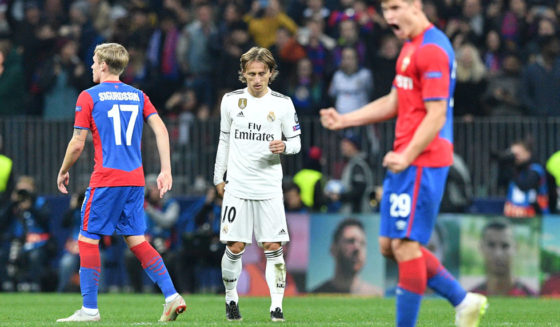 Real Madrid's Croatian midfielder Luka Modric reacts as CSKA Moscow's players celebrate the victory after the UEFA Champions League group G football match between PFC CSKA Moscow and Real Madrid CF at the Luzhniki stadium in Moscow on October 2, 2018. (Photo by Mladen ANTONOV / AFP) (Photo credit should read MLADEN ANTONOV/AFP/Getty Images)