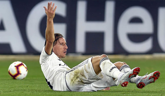 Real Madrid's Croatian midfielder Luka Modric gestures from the ground during the Spanish league football match between Deportivo Alaves and Real Madrid CF at the Mendizorroza stadium in Vitoria on October 6, 2018. (Photo by ANDER GILLENEA / AFP) (Photo credit should read ANDER GILLENEA/AFP/Getty Images)