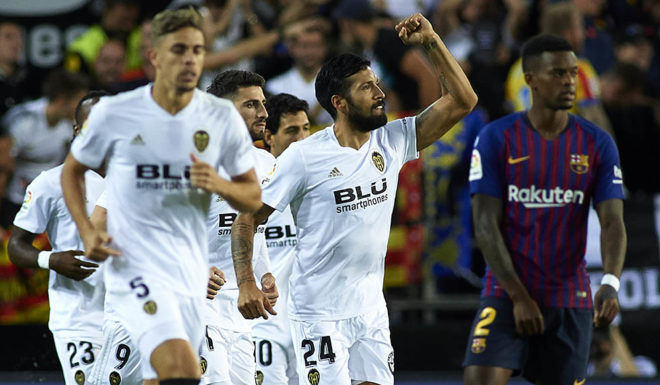 VALENCIA, SPAIN - OCTOBER 07: Ezequiel Garay of Valencia celebrates after scoring his sides first goal during the La Liga match between Valencia CF and FC Barcelona at Estadio Mestalla on October 7, 2018 in Valencia, Spain. (Photo by Manuel Queimadelos Alonso/Getty Images)