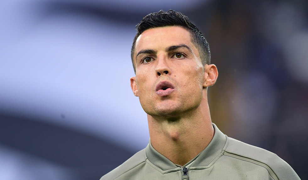 Juventus' Portuguese forward Cristiano Ronaldo is pictured prior to the Italian Serie A football match Udi-nese Calcio vs Juventus FC at the Dacia Arena stadium in Udine on October 6, 2018. (Photo by Miguel MEDINA / AFP) (Photo credit should read MIGUEL MEDINA/AFP/Getty Images)