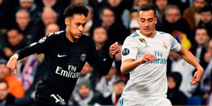 TOPSHOT - Paris Saint-Germain's Brazilian forward Neymar (C) vies with Real Madrid's German midfielder Toni Kroos (L) and Real Madrid's Spanish midfielder Lucas Vazquez during the UEFA Champions League round of sixteen first leg football match Real Madrid CF against Paris Saint-Germain (PSG) at the Santiago Bernabeu stadium in Madrid on February 14, 2018. / AFP PHOTO / CHRISTOPHE SIMON (Photo credit should read CHRISTOPHE SIMON/AFP/Getty Images)