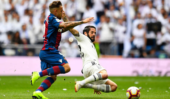 Levante's Spanish forward Roger Marti (L) vies with Real Madrid's Spanish midfielder Isco during the Spanish league football match Real Madrid CF against Levante UD at the Santiago Bernabeu stadium in Madrid on October 20, 2018. (Photo by GABRIEL BOUYS / AFP) (Photo credit should read GABRIEL BOUYS/AFP/Getty Images)