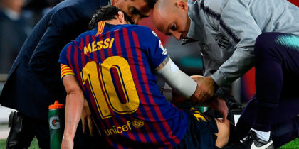 Barcelona's Argentinian forward Lionel Messi receives medical assistance during the Spanish league football match FC Barcelona against Sevilla FC at the Camp Nou stadium in Barcelona on October 20, 2018. (Photo by LLUIS GENE / AFP) (Photo credit should read LLUIS GENE/AFP/Getty Images)