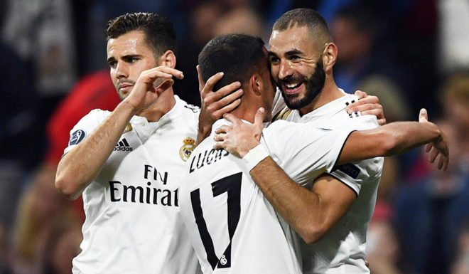 Real Madrid's French forward Karim Benzema (R) celebrates a goal with teammates during the UEFA Champions League group G football match between Real Madrid CF and FC Viktoria Plzen at the Santiago Bernabeu stadium in Madrid on October 23, 2018. (Photo by GABRIEL BOUYS / AFP) (Photo credit should read GABRIEL BOUYS/AFP/Getty Images)