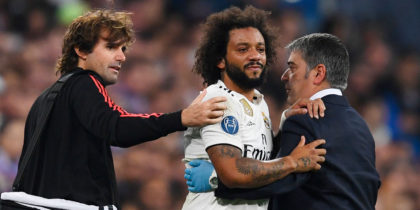 Real Madrid's Brazilian defender Marcelo (2R) is helped to leave the pitch after resulting injured during the UEFA Champions League group G football match between Real Madrid CF and FC Viktoria Plzen at the Santiago Bernabeu stadium in Madrid on October 23, 2018. (Photo by GABRIEL BOUYS / AFP) (Photo credit should read GABRIEL BOUYS/AFP/Getty Images)