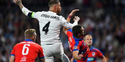 Real Madrid's Spanish defender Sergio Ramos (L) vies with Viktoria Plzen's Czech defender Radim Reznik during the UEFA Champions League group G football match between Real Madrid CF and FC Viktoria Plzen at the Santiago Bernabeu stadium in Madrid on October 23, 2018. (Photo by GABRIEL BOUYS / AFP) (Photo credit should read GABRIEL BOUYS/AFP/Getty Images)