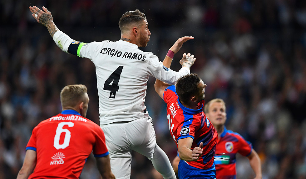 Real Madrid's Spanish defender Sergio Ramos (L) vies with Viktoria Plzen's Czech defender Radim Reznik during the UEFA Champions League group G football match between Real Madrid CF and FC Viktoria Plzen at the Santiago Bernabeu stadium in Madrid on October 23, 2018. (Photo by GABRIEL BOUYS / AFP) (Photo credit should read GABRIEL BOUYS/AFP/Getty Images)