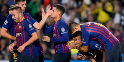 Barcelona's Brazilian midfielder Rafinha (2R) celebrates with teammates after scoring during the UEFA Champions League group B match Barcelona against Inter Milan at the Camp Nou stadium in Barcelona on October 24, 2018. (Photo by Josep LAGO / AFP) (Photo credit should read JOSEP LAGO/AFP/Getty Images)